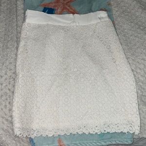 Never worn. White lace skirt. Size small
